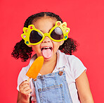 Child, sunglasses or ice cream on isolated red background or tongue, cool or summer fashion clothes. Happy, kid or girl and lolly, cold sweet or glasses in eyes healthcare, wellness or sun protection