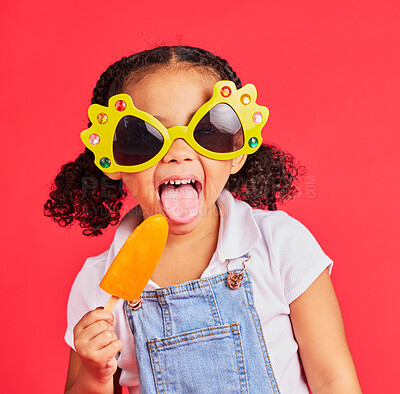 Buy stock photo Child, sunglasses or ice cream on isolated red background or tongue, cool or summer fashion clothes. Happy, kid or girl with lolly, cold sweet or funny glasses for sun protection during fun vacation