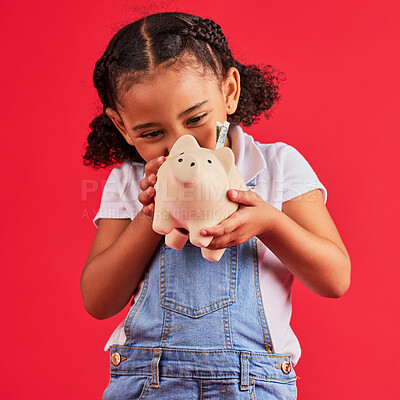 Buy stock photo Little girl, excited and piggy bank savings in money planning, finance management or future investment on isolated red background. Smile, happy child and cash box in finance growth or budget learning