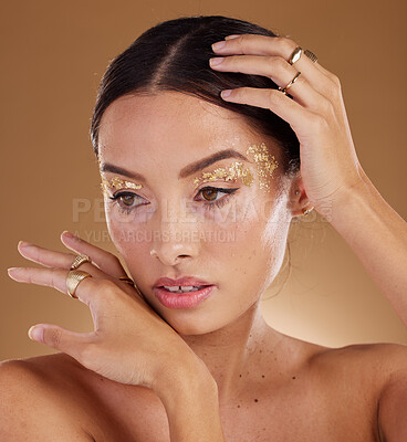 Buy stock photo Skincare, glitter and woman with cosmetics, dermatology and girl on brown studio background. Makeup, female or lady with grooming routine, natural beauty or treatment for healthy, smooth or soft skin