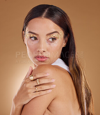 Buy stock photo Gold beauty, face glitter and woman looking with luxury eyeshadow, cosmetics product and skincare glow. Makeup, spa salon or aesthetic model girl with jewelry ring, accessories or vitiligo healthcare