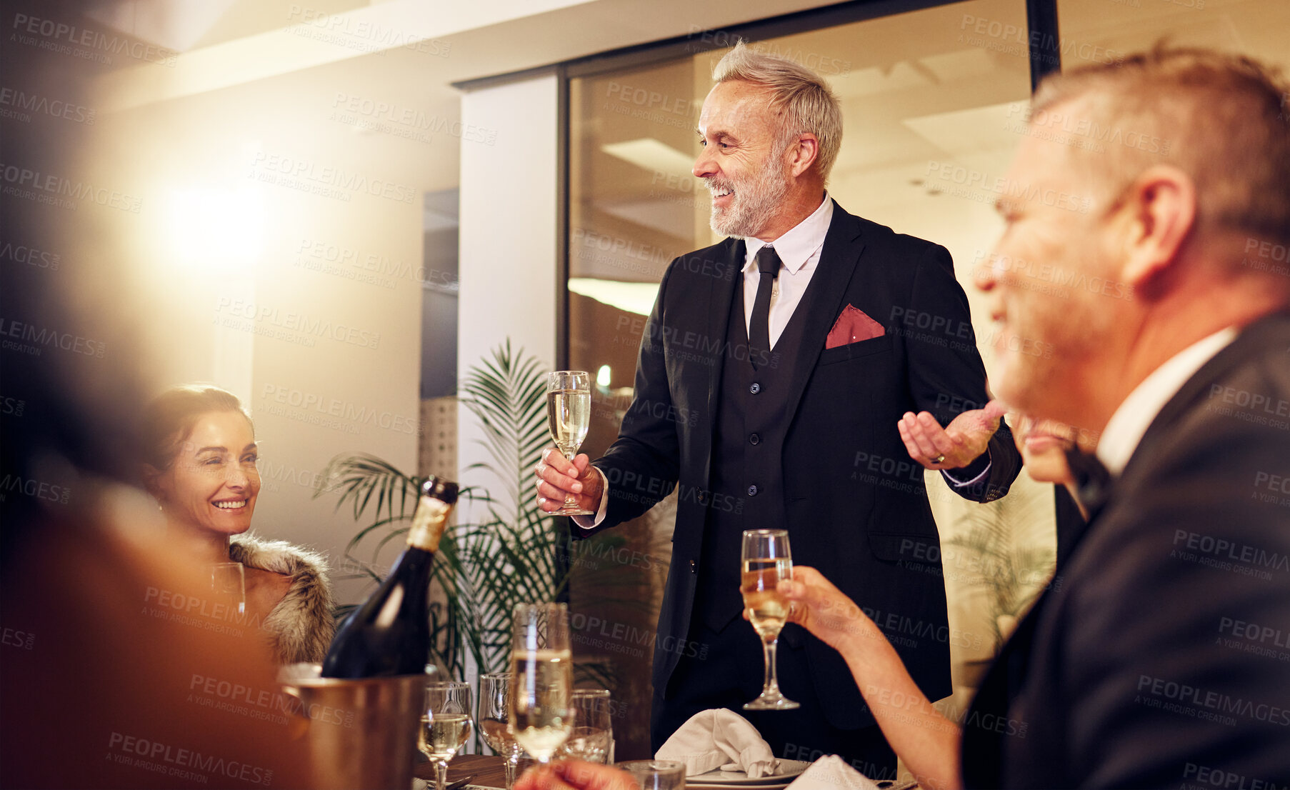 Buy stock photo Man, restaurant party and night for toast with friends, business executive team and happy for success. New year,  ceo celebration talk and people at gala with champagne, motivation and work community