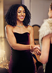 Success, handshake or black woman in a party shaking hands in a partnership agreement at an event. Thank you, congratulations or happy lady greeting or social meeting at luxury dinner gala for a deal