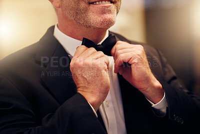 Buy stock photo Hands, wedding and bow tie with a groom getting ready for his marriage ceremony of tradition or celebration. Fashion, event and celebrating with a man wearing a suit as a gentleman to be married