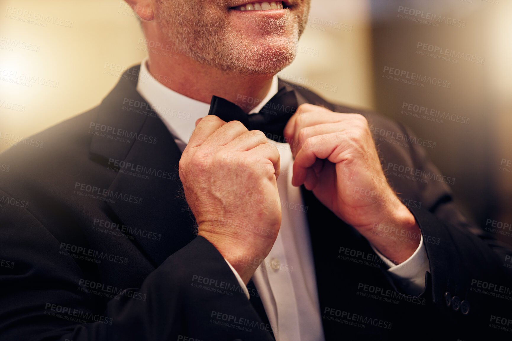 Buy stock photo Hands, wedding and bow tie with a groom getting ready for his marriage ceremony of tradition or celebration. Fashion, event and celebrating with a man wearing a suit as a gentleman to be married