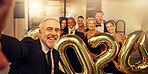 Selfie, new year and celebration with a business man and team taking a picture at an office party. Portrait, photograph and event with a mature male employee and colleague group celebrating at work