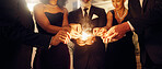 Fire, sparklers and people at a luxury party, event or celebration for new year with formal outfit. Celebrate, matches and group of friends in classy clothes at a black tie gala, banquet or dinner.