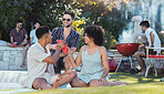 Party, diversity and toast with friends outdoor together at a bbq in summer for a social event or celebration. Alcohol, cheers or birthday with a young man and woman friend group celebrating outside