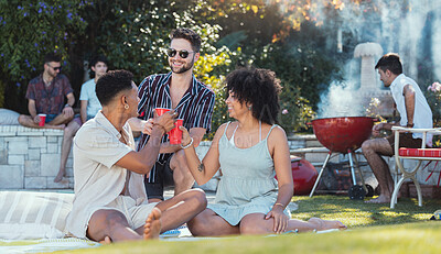 Buy stock photo Party, diversity and toast with friends outdoor together at a bbq in summer for a social event or celebration. Alcohol, cheers or birthday with a young man and woman friend group celebrating outside