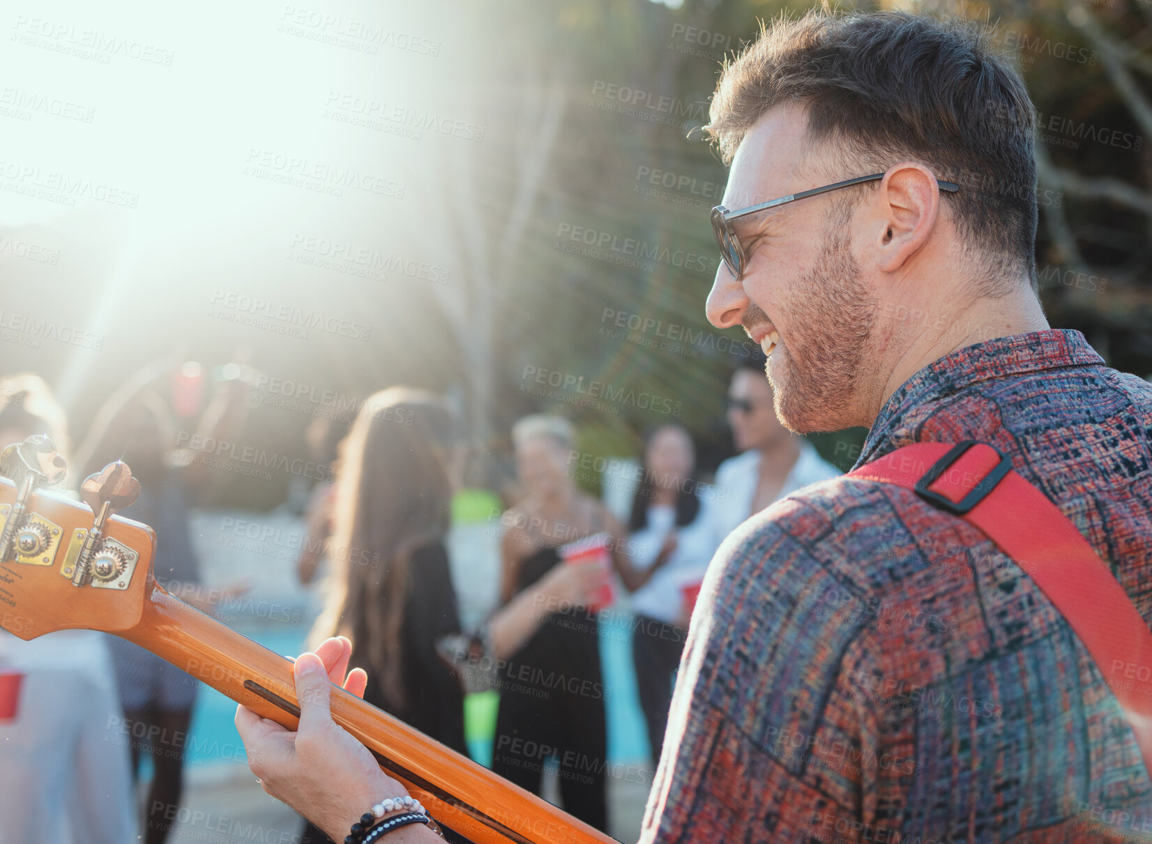 Buy stock photo Guitar, music and party with a man outdoor at a celebration playing a song as a musician or artist. Happy, fun and performance with a male guitarist holding an instrument to perform at a birthday