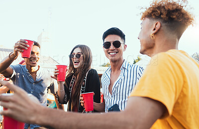 Buy stock photo Group of friends, drinks and a party outdoor to celebrate at  festival, celebration or summer social event. Diversity young men and women people together while talking, happy and drinking alcohol