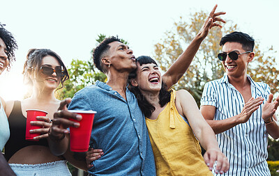 Buy stock photo Drinks, party and a couple of friends dancing outdoor to celebrate at festival, concert or social event. Diversity young men and women people together in summer, happy and drinking alcohol in crowd