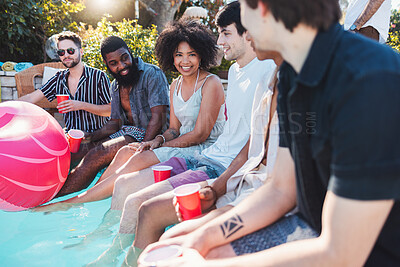 Buy stock photo Holiday, drinks and people speaking in a pool at a summer party, celebration or event at a home. Diversity, vacation and friends talking, having fun and bonding by the swimming pool while drinking.