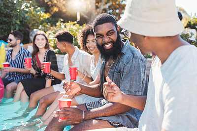 Buy stock photo Vacation, drinks and friends speaking in a pool at a summer party, celebration or event at a home. Diversity, happy and people talking, having fun and bonding by the swimming pool while drinking.
