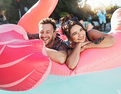 Buy stock photo Pool party, portrait and happy couple floating in the water together while on vacation at a resort. Float, summer and young man and woman in a swimming pool having fun on a holiday or weekend trip.