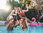 Happy, fun and portrait of friends in the pool for summer, swimming and party in Miami. Smile, playful and group of people in the water for a game, relax and holiday celebration together at a hotel