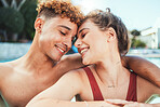Party, pool and diversity with a couple of friends swimming outdoor together during summer. Love, water and swim with a young man and woman swimmer enjoying a birthday or celebration event
