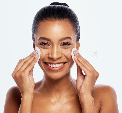 Buy stock photo Beauty, skin and cotton for black woman portrait studio for dermatology, cosmetics and natural skincare. Aesthetic model person cleaning face or makeup for healthy glow isolated on a white background