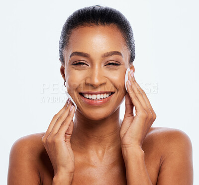 Buy stock photo Black woman, beauty and cotton on face portrait in studio for dermatology, cosmetics and natural skin. Happy aesthetic model cleaning makeup for self care facial glow isolated on a white background