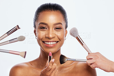 Buy stock photo Makeup, beauty brush and lipstick on face of woman portrait in studio for dermatology cosmetics. Happy aesthetic model person with facial tools for healthy skin glow isolated on a white background