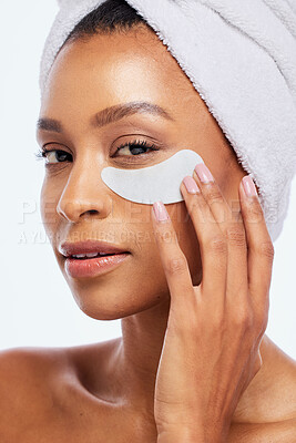 Buy stock photo Spa eye patch, skincare and beauty of a woman portrait in studio for dermatology. Aesthetic model for spa facial, towel and healthy or natural face glow, hand on cosmetic isolated on white background