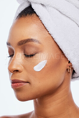 Buy stock photo Black woman, skin care and beauty cream in studio for dermatology, cosmetics and natural glow. Aesthetic model person with luxury spa facial and healthy face with towel isolated on a white background