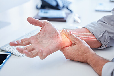 Buy stock photo Closeup, business and man with wrist pain, while working and overworked with muscle strain, office and injury. Zoom, male employee or consultant holding hand, suffering from arthritis or inflammation