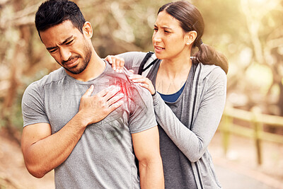 Buy stock photo Fitness, pain and injury with a woman massaging the shoulder of her boyfriend while running outdoor. Exercise, medical and hurt joint with a couple training outside during a workout for health