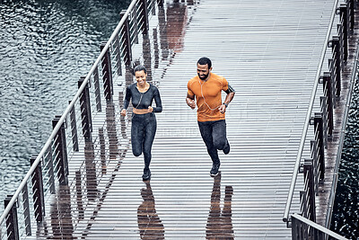 Buy stock photo Top view, run or couple training, seaside or workout for wellness, healthy lifestyle or practice together. Running, black man or woman with exercise, promenade or performance with endurance or energy