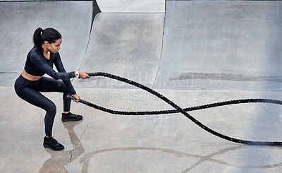 Buy stock photo Fitness, battle ropes and strong with a black woman athlete outdoor for a workout from above. Exercise, energy and power with a female training outside using a heavy rope for cardio or endurance 