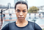 Fitness, exercise and portrait of a woman athlete in the city for an outdoor run or sports training. Serious, motivation and young female runner with crossed arms after a cardio workout outside.