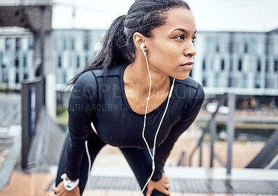 Buy stock photo Fitness, motivation and black woman with music in city for wellness, healthy body and cardio workout outdoors. Sports, focus and girl listening to audio for exercise, running and marathon training