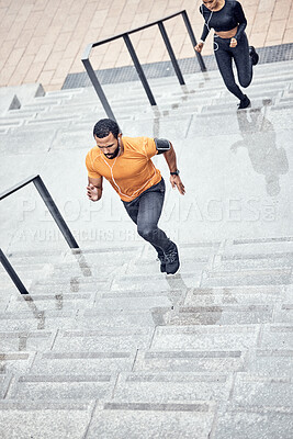 Buy stock photo Fitness, rain and people running outdoor for muscle wellness, music and energy in winter focus. Urban stairs, Black man, runner couple or personal trainer speed for cardio workout or exercise above