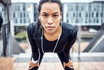 Buy stock photo Portrait, tired and serious with a sports black woman taking a rest from her exercise workout in the city. Face, music and fitness with a young female runner or athlete training alone outside