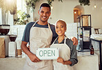 Coffee shop, portrait and open sign by small business owners at a cafe in support together. Team, collaboration and friends smiling due to startup growth and proud of success or vision