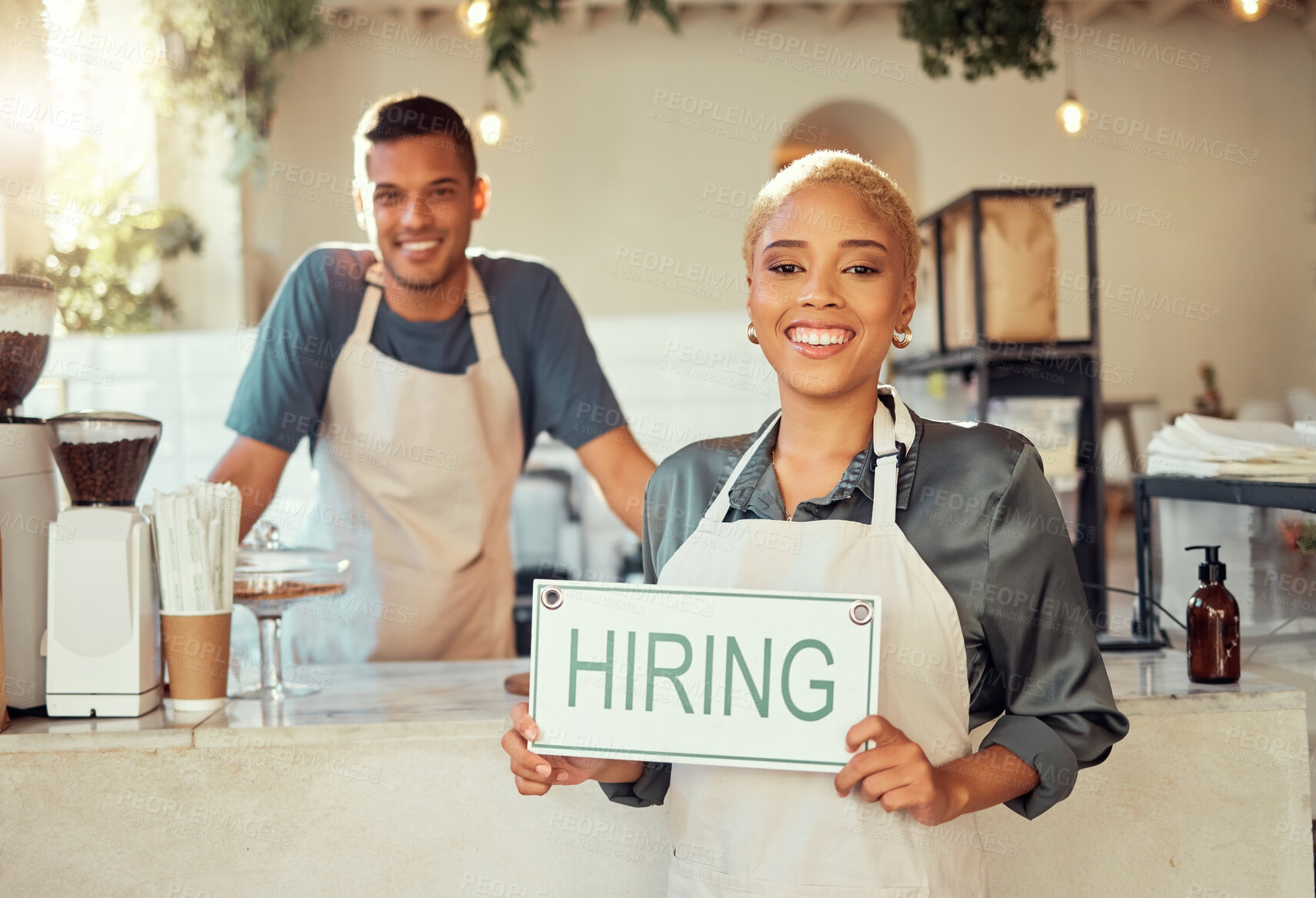 Buy stock photo Portrait, leader and hiring sign small business owner happy at coffee shop or cafe with employee. Team, collaboration and recruitment due to startup growth and vacancy to join us for a job