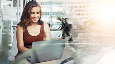 Buy stock photo Woman, laptop and typing in coffee shop, cafe or restaurant for internet blogging, internet research or education course. Smile, happy and entrepreneur on technology with lens flare or freelance app