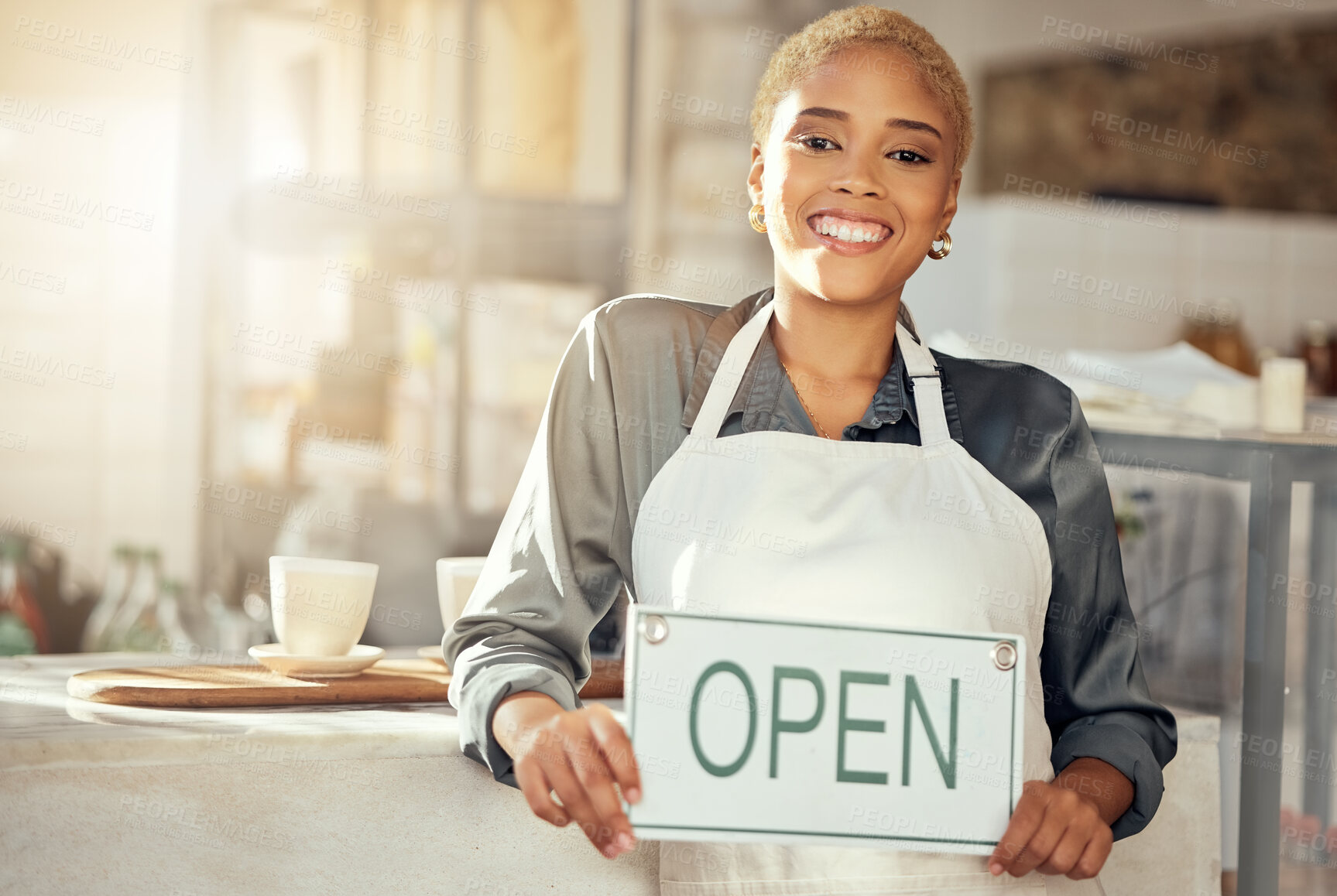 Buy stock photo Showing, smile and portrait of a business owner with an open sign at a cafe in the morning. Restaurant, happy and woman with a board at a coffee shop with a welcome, smiling and server at a cafeteria