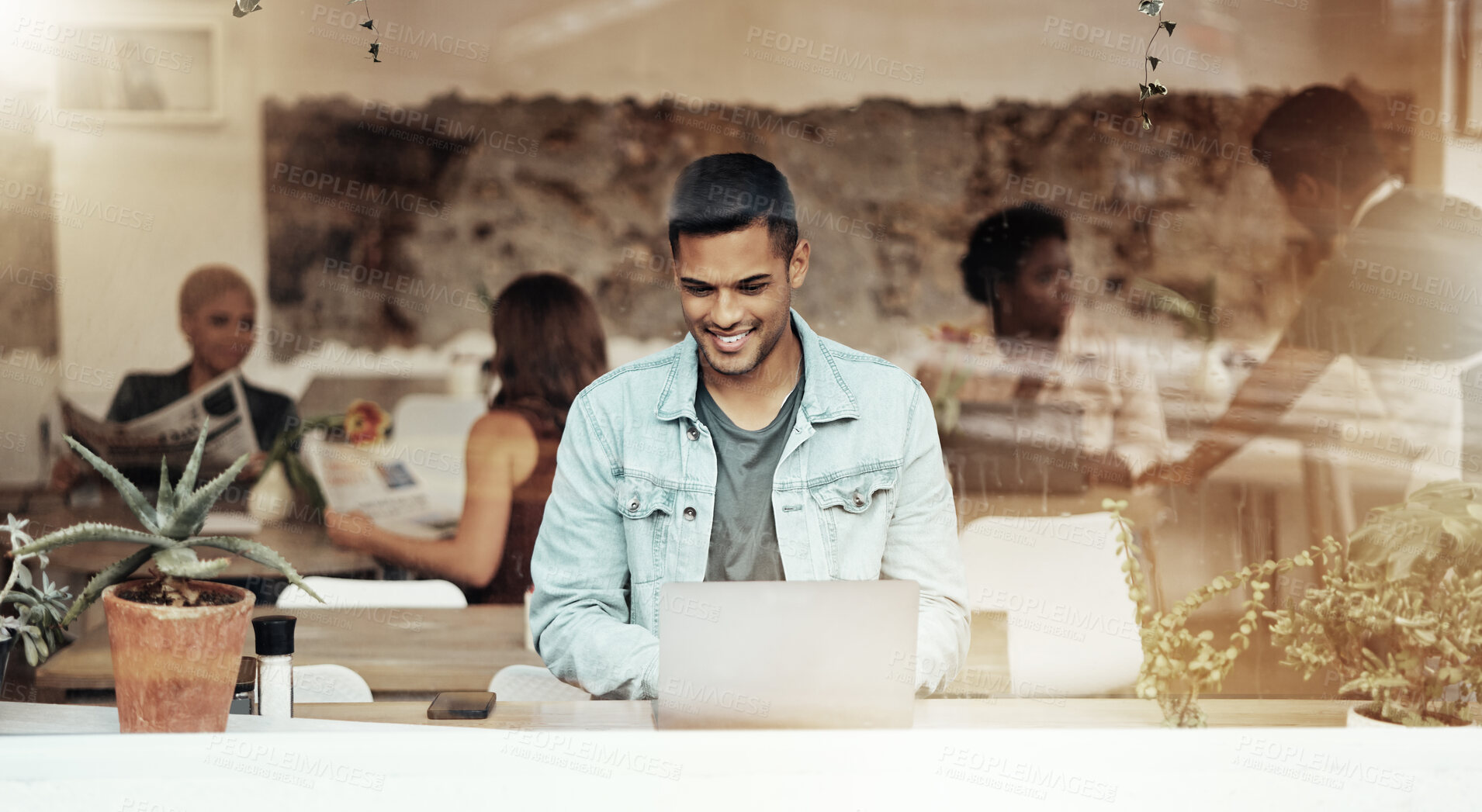 Buy stock photo Smile, internet and man with laptop in cafe typing email and networking for freelance job in restaurant window. Technology, communication and remote work, happy freelancer in coffee shop at computer.