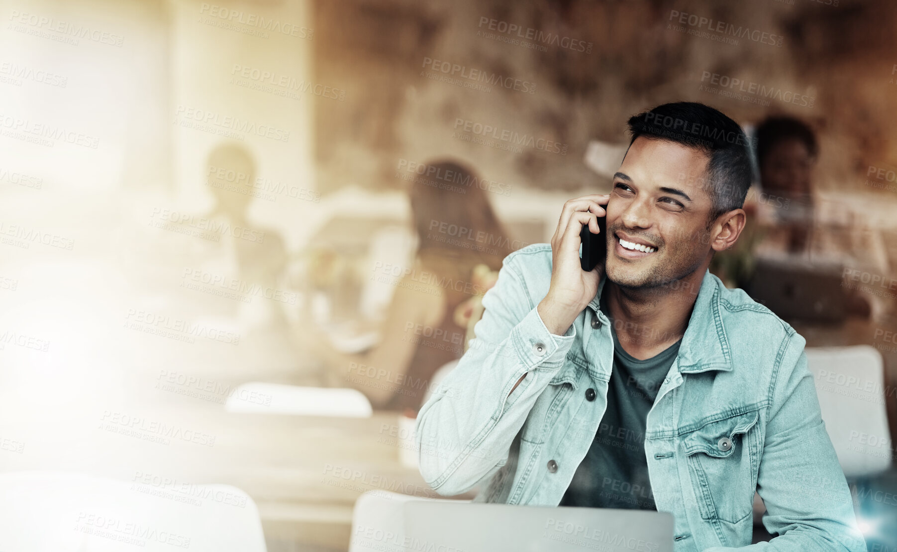 Buy stock photo Creative man, phone and smile for communication, networking or conversation at coffee shop. Happy male freelancer smiling for call, discussion or startup with smartphone by laptop at cafe restaurant