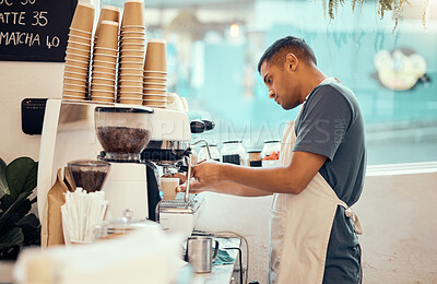 Buy stock photo Coffee shop, machine and man barista working on a espresso or latte order in the restaurant. Morning, cafeteria and male waiter from Mexico preparing a caffeine or tea warm beverage in a cafe.