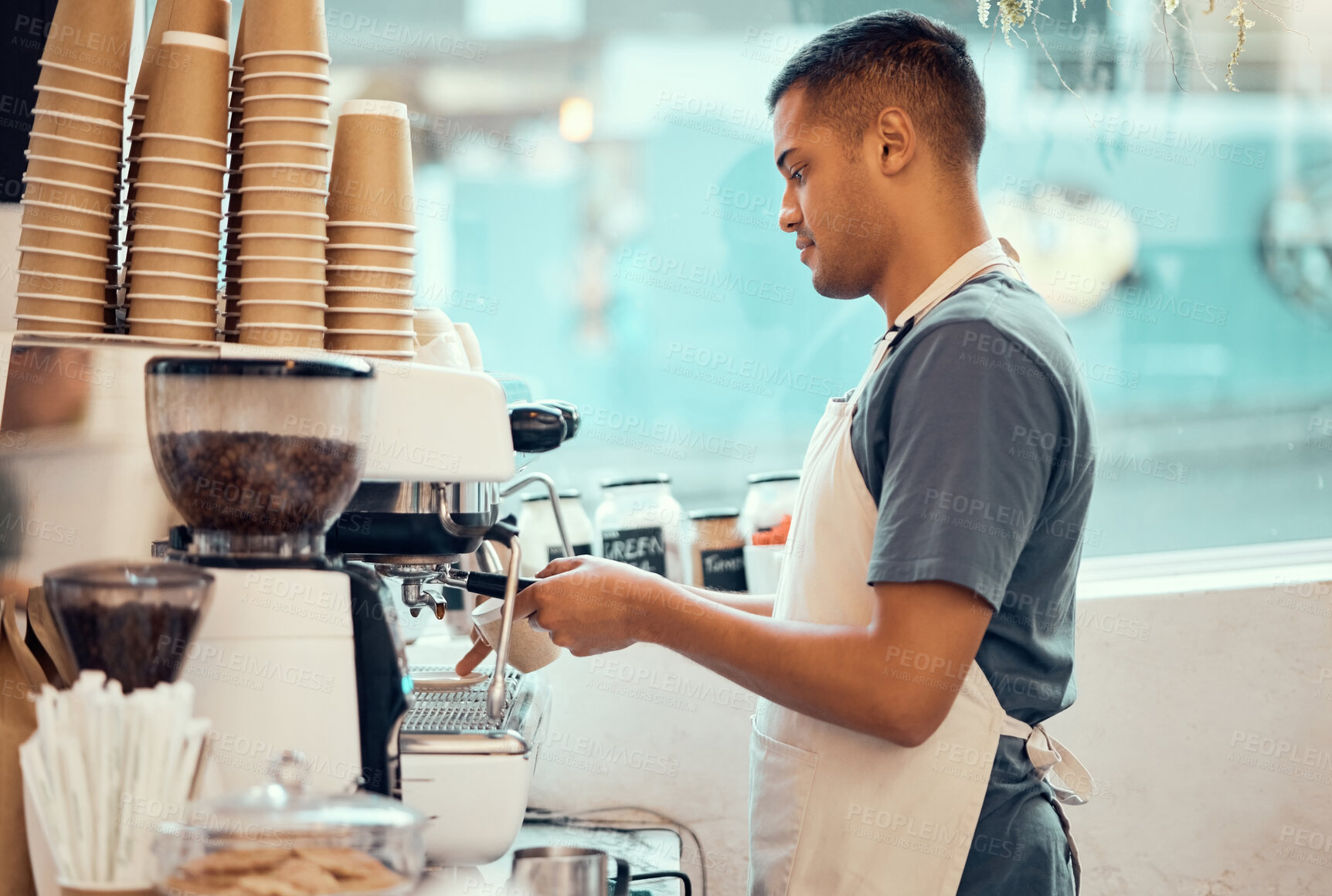 Buy stock photo Cafe, coffee machine and man barista working on a espresso or latte order in the restaurant. Morning, cafeteria and male waiter from Mexico preparing a caffeine or tea warm beverage in a coffee shop.