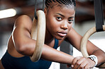 Fitness, gymnastics and portrait of black woman with rings for training, exercise and workout at gym. Wellness, motivation and face of girl athlete with focus for competition, performance and sports