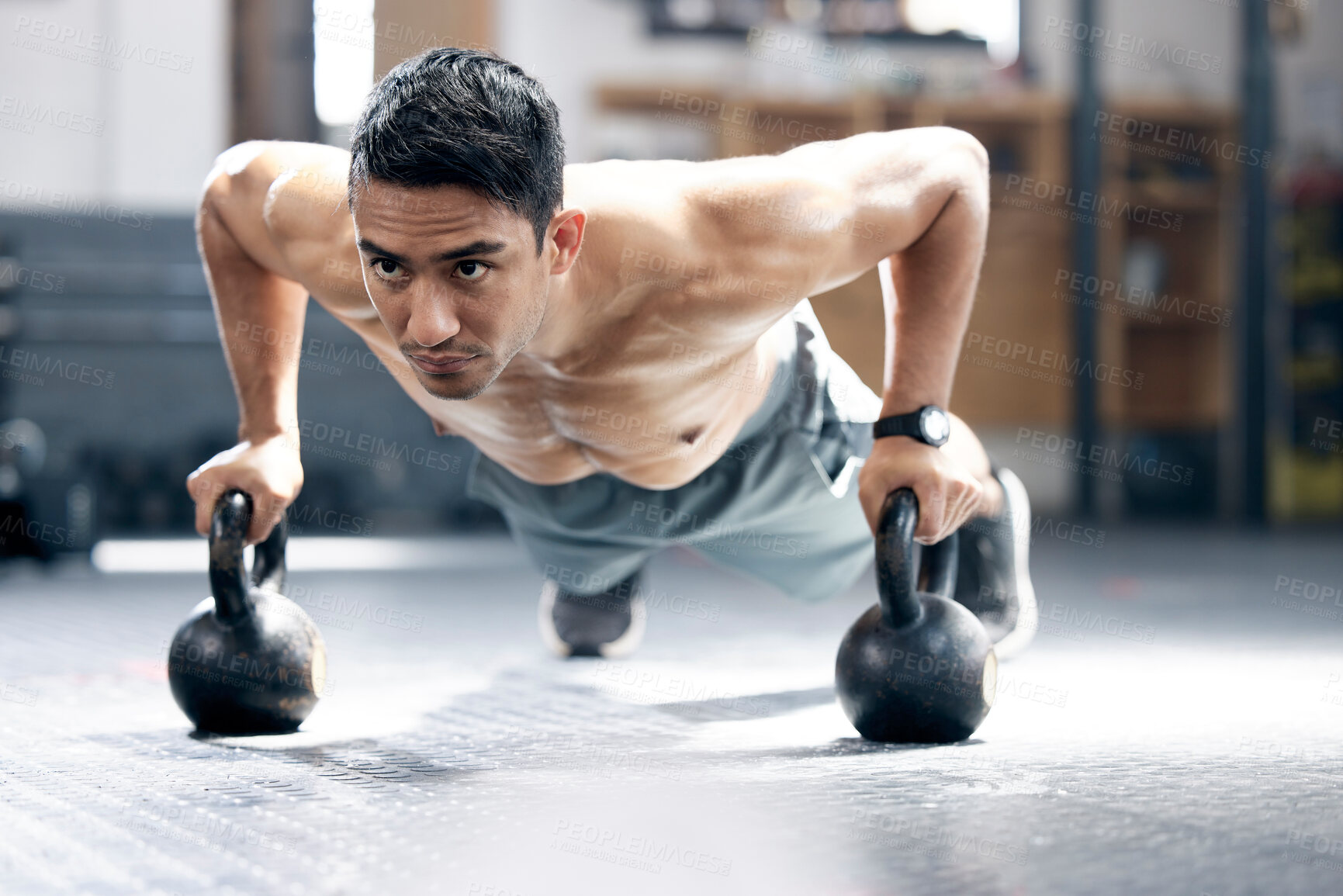 Buy stock photo Fitness, push up or man with kettlebell for training, body workout or exercise at health club studio. Motivation, mindset or healthy Indian sports athlete exercising with focus or resilience at gym