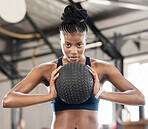 Portrait, medicine ball or black woman in training, workout or exercise for balance or strengthen muscles. Focused girl, mindset or healthy African athlete with goals, motivation or focus at gym