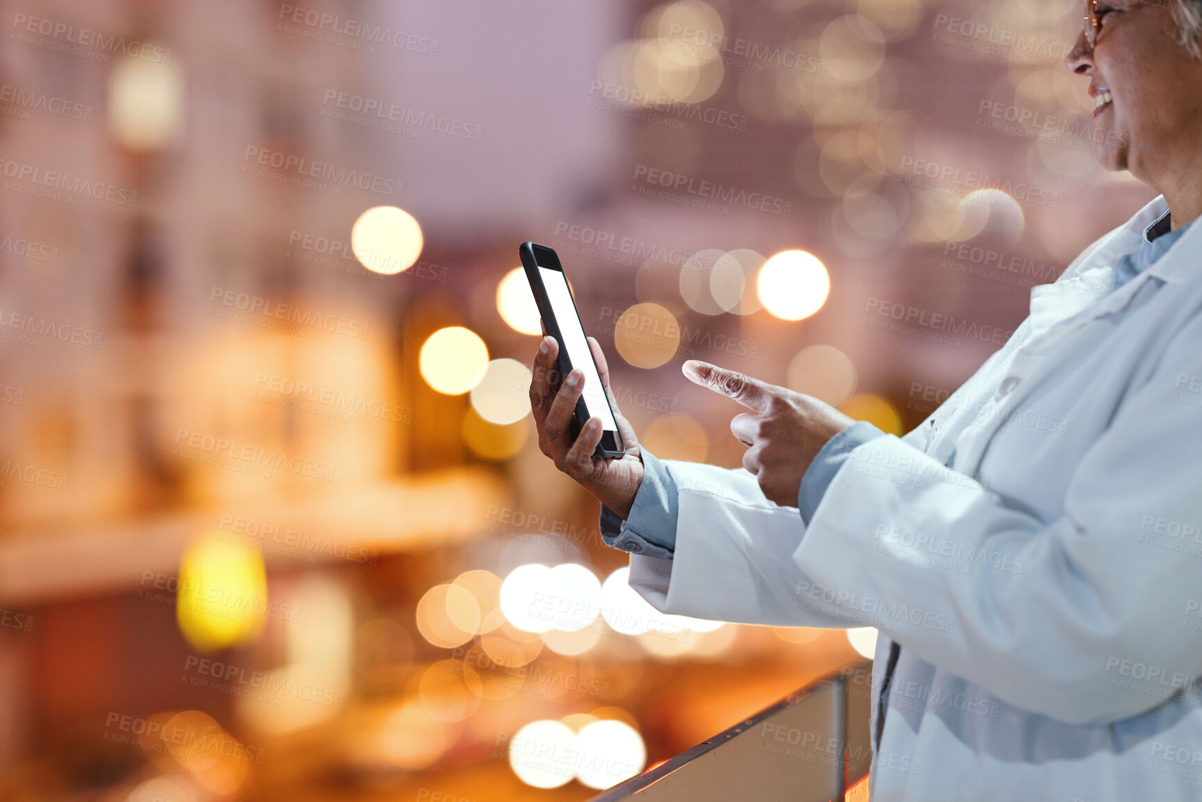 Buy stock photo Doctor, hands and phone on balcony in the night city for communication, healthcare or advice. Hand of senior woman, medical expert or nurse in research, networking or chatting on mobile 5G smartphone