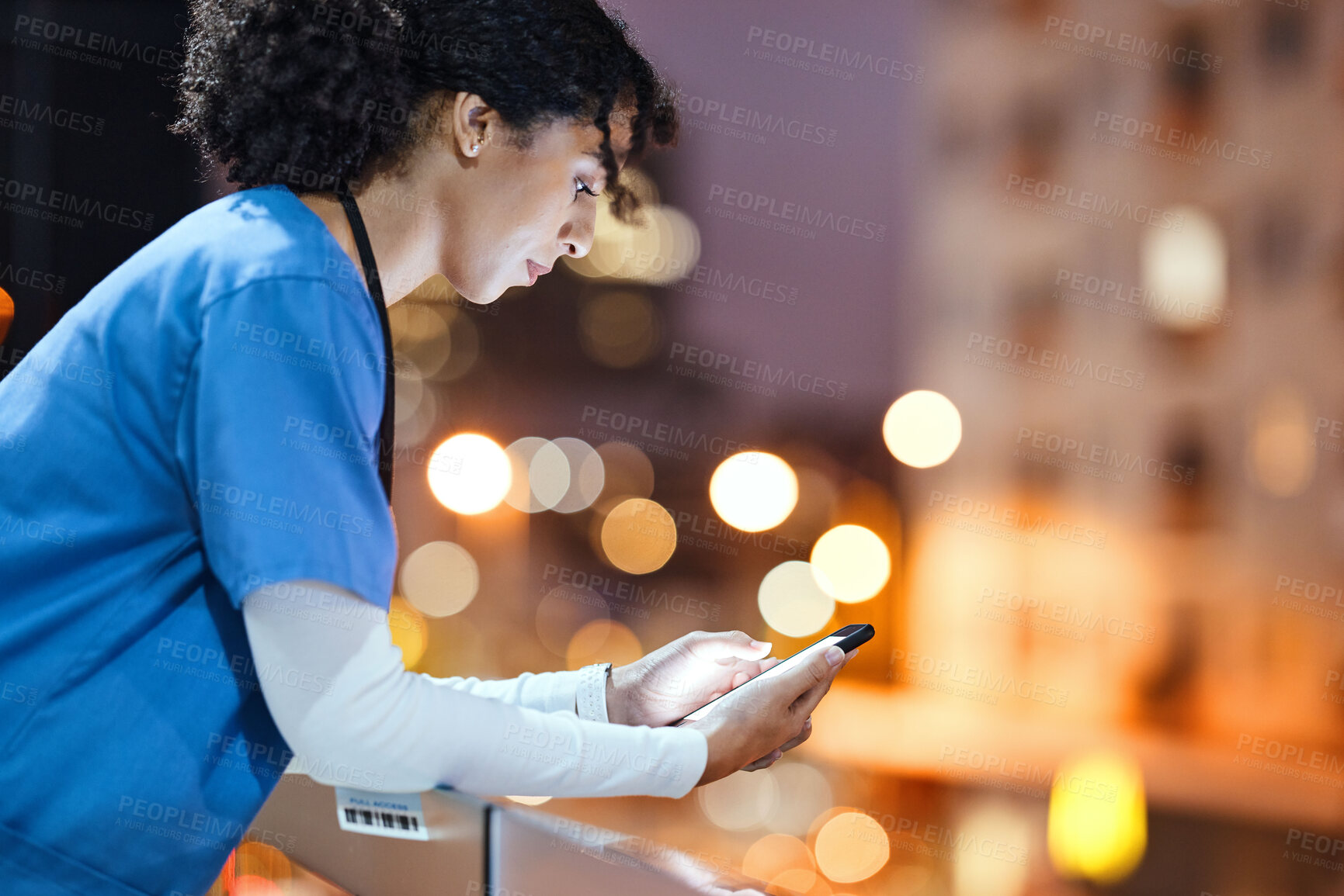 Buy stock photo Night, doctor and woman texting in city while on a break, internet and search against a bokeh background. Nurse, female and online app for schedule, calendar and planner while relaxing on a balcony