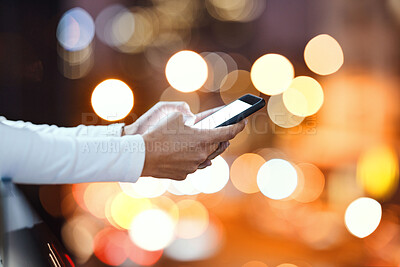 Buy stock photo Closeup, hands and person texting in a city at night, blank and screen with mockup against bokeh background. Zoom, fingers and hand with smartphone and copy space for text, chat or online search