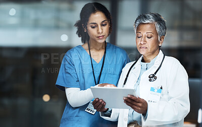 Buy stock photo Doctors, women and digital tablet for night teamwork, medical research or surgery planning in wellness hospital. Thinking, healthcare and worker nurse in collaboration on technology for late schedule