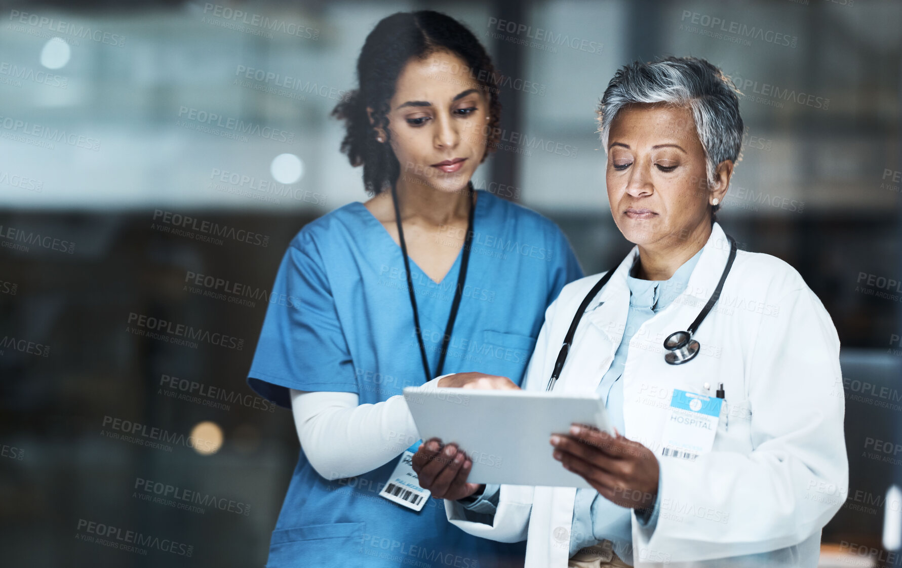 Buy stock photo Doctors, women and digital tablet for night teamwork, medical research or surgery planning in wellness hospital. Thinking, healthcare and worker nurse in collaboration on technology for late schedule